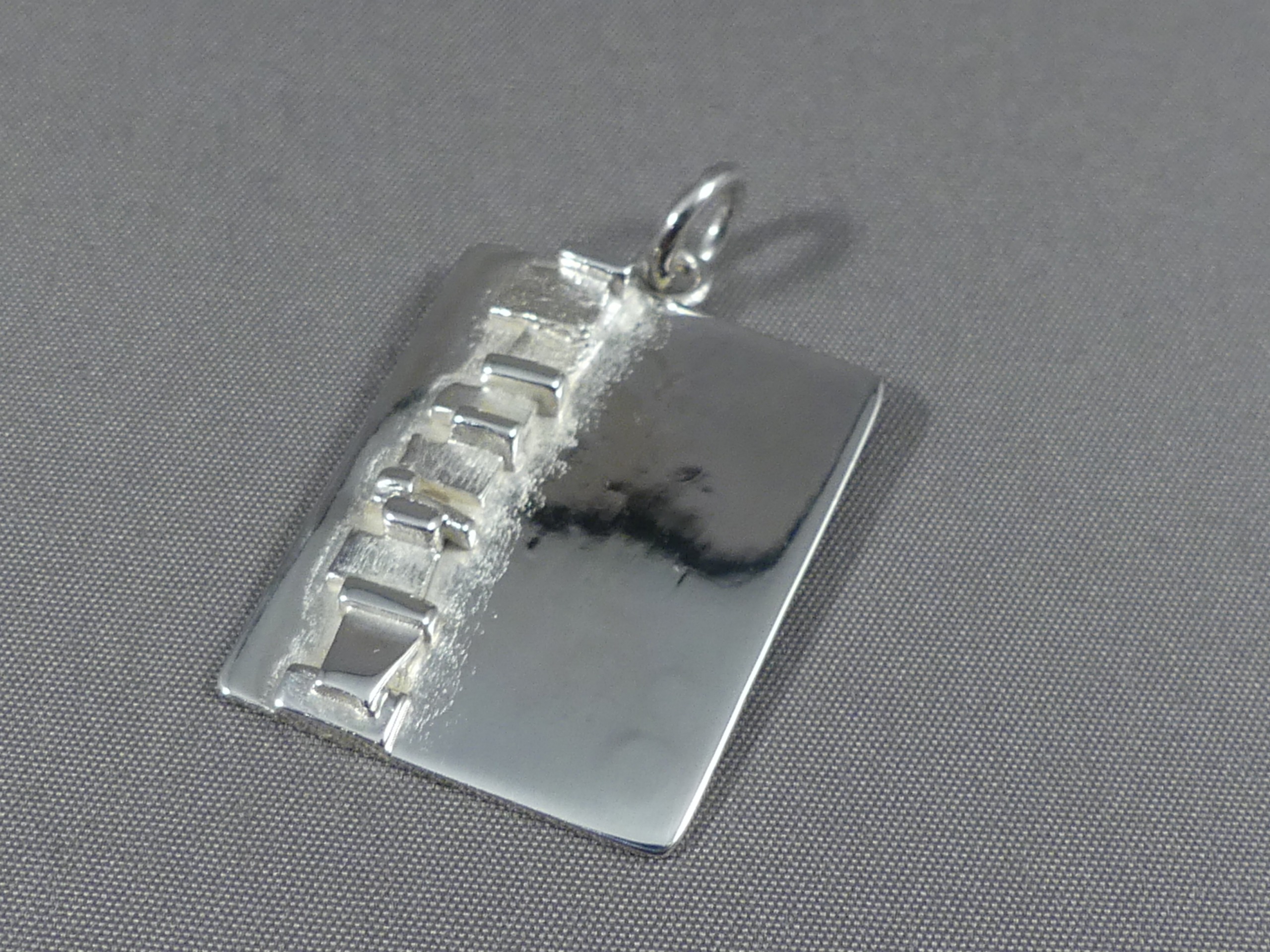 Verwachting meloen tekst zilveren hanger graveerplaat | Juwelier Helmond